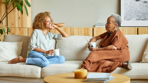 Family members discussing medical history on couch