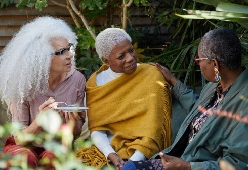Three black women discussing endometrial cancer risk factors